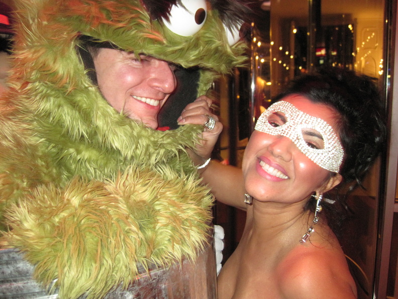 Oscar the Grouch and a girl in a mask
