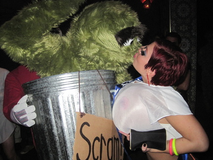 Oscar the Grouch getting a kiss from the Wet T-shirt winner