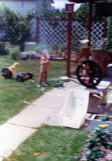 1980 Dana playing with the hose in summer576